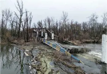  ?? — Reuters ?? A view shows a bridge over the Siverskyi Donets river destroyed in Bohorodych­ne, Donetsk region, Ukraine.