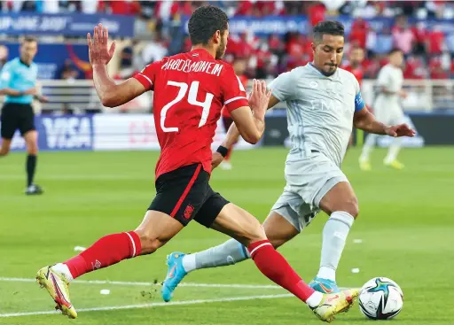  ?? Mehdi Nafti
File/AFP ?? I am up to date with what is going on with the other teams and so I know very well what awaits us at the Club World Cup.
Al-Hilal’s midfielder Salem Al-Dawsari, right, in action against AlAhly’s Mohamed Abdulmonem during their 2021 FIFA Club World Cup match on Feb. 12, 2022.