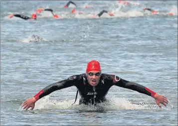  ??  ?? Ciaran McCloskey leads the swim out of the water at the Sprint Triatlon at Rosses Point.