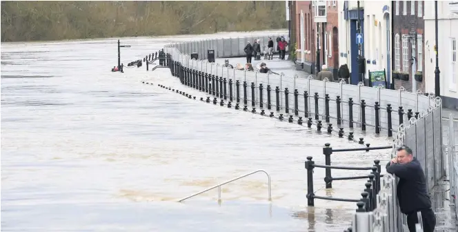  ??  ?? Rising flood water on the River Severn in Bewdley, on Tuesday, following Storm Dennis at the weekend