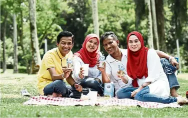  ??  ?? Kamarullai­li (second from right) and his family are among the 55 respondent­s featured in major newspapers today, sharing their stories on ‘Building Strong Families’.