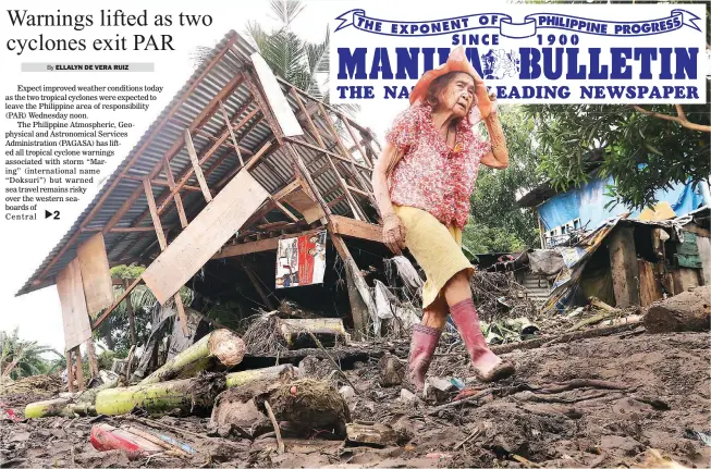  ??  ?? MARING’S AFTERMATH – A woman returns Wednesday to her house in Barangay Tubag, Calamba, Laguna, that was demolished by a flashflood triggered by heavy rains from tropical depression ‘Maring.’ (Ali Vicoy)