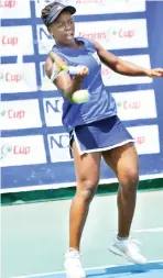  ??  ?? Loveth returns the ball to her opponent during last weekend’s match in the NCC Tennis League match