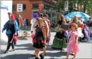  ?? FILE PHOTO ?? Event-goers parade during the third annual Enchanted City festival in downtown Troy.