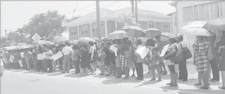  ??  ?? Some of the teachers who converged outside of Region Three’s Education Department on Tuesday morning.