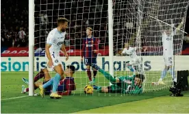  ?? Photograph: Albert Gea/Reuters ?? Girona's Cristhian Stuani scores their fourth goal to make sure of victory against Barcelona.