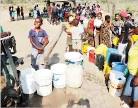  ??  ?? Residents queue to fetch water at a borehole in Luveve 4, Bulawayo, yesterday. The borehole also serves five nearby suburbs — (Picture by Eliah Saushoma)