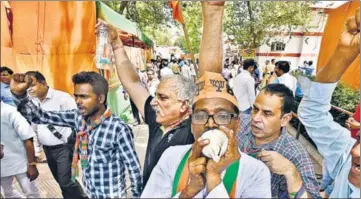  ?? RAJ K RAJ/HT PHOTO ?? BJP workers celebrate the party’s victory in the municipal elections outside their office on Pandit Pant Marg.