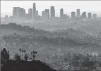  ?? File photo ?? Early-morning smog envelops Los Angeles, one of the worsthit cities in the United States.