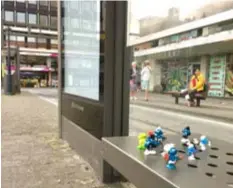  ??  ?? Smurfs, Gargamel and a Frog waiting for the Bus.