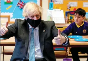  ??  ?? THUMBS UP: Prime Minister Boris Johnson at a school in Stoke on Trent last week