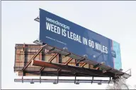  ?? Arnold Gold / Hearst Connecticu­t Media ?? A billboard advertisin­g marijuana in Massachuse­tts faces travelers on northbound I-91 in New Haven.