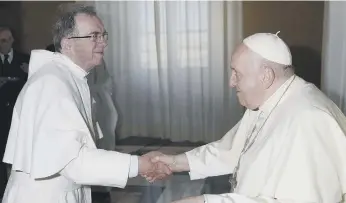  ?? ?? Father Martin Gosling (above) and Father Thomas Swaffer (below) meet Pope Francis.