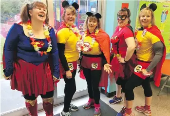  ?? GORD KURENOFF ?? The Langley Sun Run InTraining clinic, led by coordinato­r Sandra Jongs Sayer, second from right, held a surprise super heroes run to mark Sun staffer Gord Kurenoff’s birthday last year. From left: Michele Anderson, Brenda Kerslake, Debbie Elliott and...