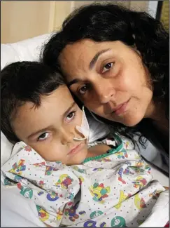  ??  ?? Bedside vigil: Ashya King pictured with his mother Naghmeh
