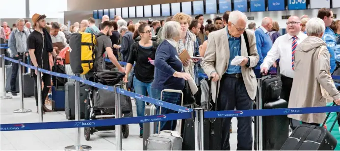  ??  ?? Queues: The ban is likely to cause confusion at check-in desks