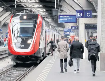  ?? REUTERS ?? The Bombardier FV-Dosto double-deck train ‘Ville de Geneve’ of Swiss Federal Railways is seen at the central station in Zurich in this file photo.