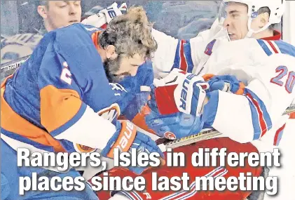  ?? Paul J. Bereswill ?? BIG CLASH: Nick Leddy (left) checks Chris Kreider during the Islanders’ 4-2 victory over the Rangers on Dec. 6, the last time the rivals saw one another. They will face off again Thursday in Brooklyn.