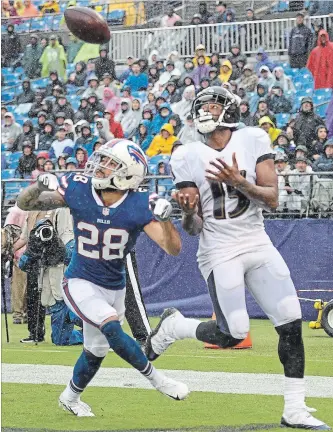  ?? NICK WASS
THE ASSOCIATED PRESS ?? Baltimore Ravens wide receiver Michael Crabtree, right, gets ready to pull in a touchdown pass as Buffalo Bills defensive back Phillip Gaines looks on during the first half Sunday. The Bills had a rought start to the season.