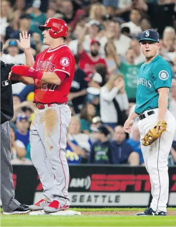  ?? LINDSEY WASSON/GETTY IMAGES ?? Neither Mike Trout’s Los Angeles Angels nor Kyle Seager’s Seattle Mariners have a positive run differenti­al, and both teams are right around .500 — but they’re both in the playoff hunt.