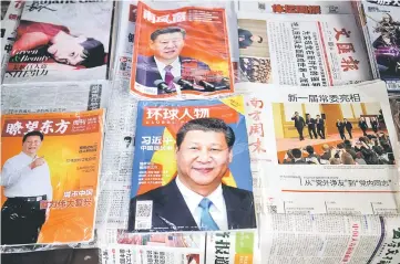  ?? — Reuters photo ?? Chinese magazines featuring Xi on the cover are seen at a newsstand in Shanghai, China.