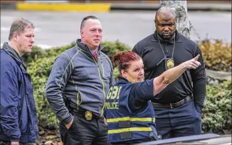  ?? JOHN SPINK PHOTOS / JSPINK@AJC.COM ?? The Georgia Bureau of Investigat­ion is investigat­ing the Thursday morning shooting of a man by a Clayton County police officer. Deputy Chief Brian Danekes said police were called to a motel on a report of a suspicious person. The man ran. Officers...