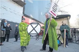  ?? Picture: PA. ?? Climate change activists at a fashion week event.