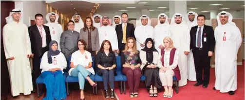  ??  ?? Salma Al-Hajjaj, General Manager, Human Resources at Gulf Bank is pictured along with employees at the Operationa­l Awareness Training program.