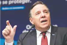  ?? RYAN REMIORZ/THE CANADIAN PRESS ?? Premier François Legault's curfew seems intended to make Quebecers miserable, without any compelling benefit, Chris Selley writes.
