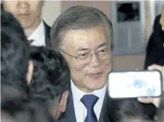  ?? LEE JIN-MAN/THE ASSOCIATED PRESS ?? Moon Jae-in is greeted by supporters in front of his house in Seoul, South Korea, on Tuesday. Moon declared victory in South Korea’s presidenti­al election after his two main rivals conceded.