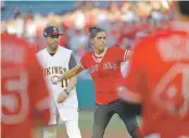  ?? MARCIO JOSE SANCHEZ/ASSOCIATED PRESS ?? Debbie Hetman, the mother of late Angels pitcher Tyler Skaggs, throws the ceremonial first pitch Friday in Anaheim, Calif. It was the Angels’ first home game since Skaggs was found dead July 1 in his hotel room.