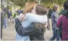 ?? SARAH REINGEWIRT­Z/ THE ORANGE COUNTY REGISTER VIA AP ?? Kyra Stapp, 17, reunites with her mom, Tracy, after the shooting.
