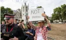  ?? Photograph: Antonio Olmos/The Guardian ?? A protester airs her views outside parliament as King Charles arrives.