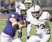  ?? / Jeremy Stewart ?? Darlington’s Kolin Rogers (left) runs the ball down the field past Whitefield Academy’s Walker Smith (73) during Friday’s Region 6-A crossover game at Chris Hunter Stadium.