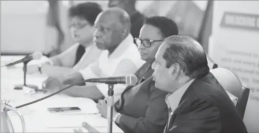  ?? (Photo by Terrence Thompson) ?? Prime Minister Moses Nagamootoo, who is acting as president, addressing the press at yesterday’s joint APNU and AFC press conference at Congress Place, Sophia. Also seated at the head table are Public Infrastruc­ture Minister David Patterson (partially obscured), Social Protection Minister Amna Ally, Foreign Affairs Minister Carl Greenidge and Public Health Minister Volda Lawrence.