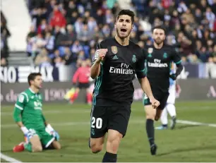  ?? Reuters ?? real’s marco asensio celebrates his winner against Leganes during the Copa del rey match. —
