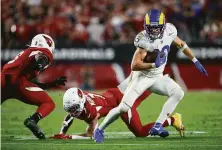  ?? Ralph Freso / Associated Press ?? Cooper Kupp (10) and the Rams’ win over the Cardinals on Monday night made the NFC West more intense.