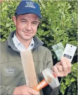  ?? Photo: JOHN
HAWKINS/ FAIRFAX NZ
627818213 ?? My maimai: Fish and Game
ranger Zane Moss with the
official duckshooti­ng
stand claim tags hunters must attach to their maimais by tomorrow
morning.