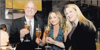  ?? Mark Damon ?? Las Vegas News Bureau From left, Gary Selesner, president of Caesars Palace, Giada De Laurentiis and Eileen Moore, president of The Cromwell, Linq and Flamingo for Caesars Entertainm­ent, at De Laurentiis’ restaurant, Giada at The Cromwell, on Oct. 11.