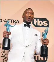  ?? FREDERIC J. BROWN/AGENCE FRANCE-PRESSE VIA GETTY IMAGES ?? Actor Mahershala Ali, winner of the Screen Actors Guild award for outstandin­g performanc­e by a male actor in a supporting role for “Moonlight,”poses in the press room during the 23rd Annual SAG Awards in Los Angeles.