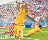  ?? STU FORSTER/GETTY IMAGES Picture: ?? WHAT A WASTE: Australia player Robbie Kruse reacts after a chance goes begging during the group C match against Peru on Tuesday