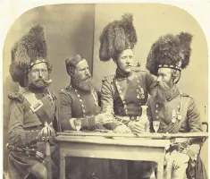  ??  ?? Highlander­s, two with the Crimea Medal, photograph­ed by Joseph Cundall in 1856