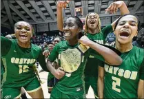  ?? HYOSUB SHIN/HYOSUB.SHIN@AJC.COM ?? Grayson’s Danielle Carnegie (center) wears the championsh­ip belt as the Rams celebrate a victory over North Paulding in the GHSA Class 7A state final in Macon.