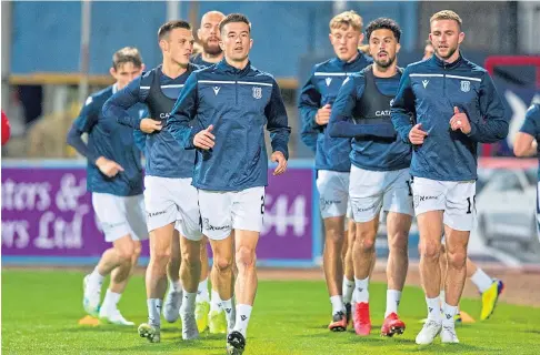  ??  ?? EXTRA SESSION: Dundee were put through their paces at Dens last night after their Betfred Cup opener was called off.