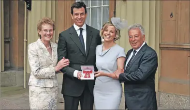  ??  ?? Susie Wolff poses with her MBE medal alongside mum Sally Stoddart, dad John Stoddart and husband Toto Wolff.