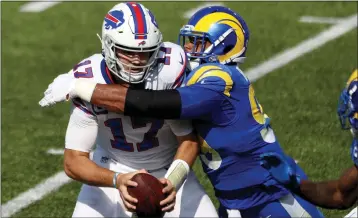  ?? BRYANT M. BENNETT — GETTY IMAGES ?? The Rams and Aaron Donald, tackling Buffalo QB Josh Allen in a 2020game, will host the Bills in their 2022season opener.