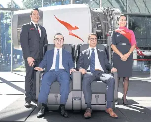  ?? AFP ?? Qantas Airways CEO Alan Joyce, left, and chief financial officer Tino La Spina test out the premium economy seat for the airline’s new 787-9 Dreamliner after a press conference in Sydney yesterday.