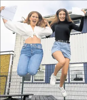  ?? ?? Kennet pupils Millie Huckins, right, who got three A*s, and Esme Lister, who achieved two A*s and one A Ref: 32-1321