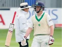  ?? AFP ?? Kevin OBrien of Ireland walks back to the pavilion after losing his wicket for 118 runs on the final day of their inaugural Test against Pakistan at Malahide Cricket Club in Dublin on Tuesday. —