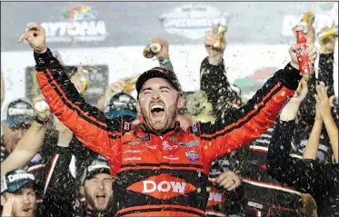  ?? AP/CHUCK BURTON ?? Austin Dillon celebrates in Victory Lane after winning the Daytona 500 on Sunday at Daytona Internatio­nal Speedway in Daytona Beach, Fla. Dillon won the race driving the No. 3 Chevrolet that racing legend Dale Earnhardt piloted for most of his career.
